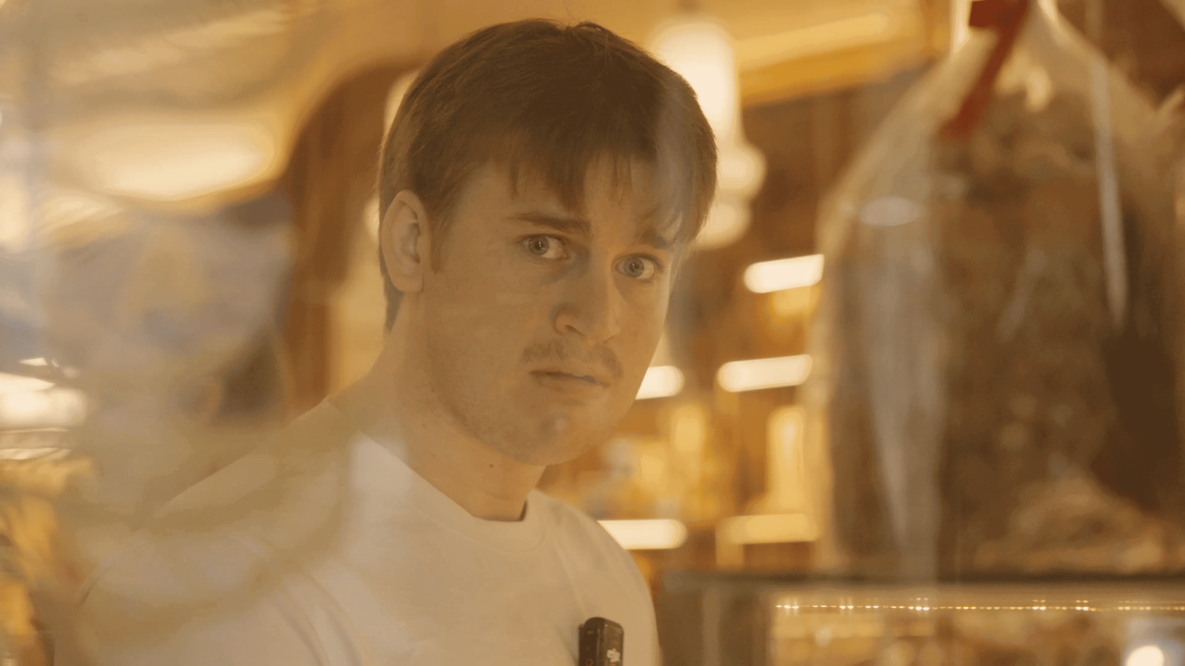 Opencode team member reflected in a restaurant window