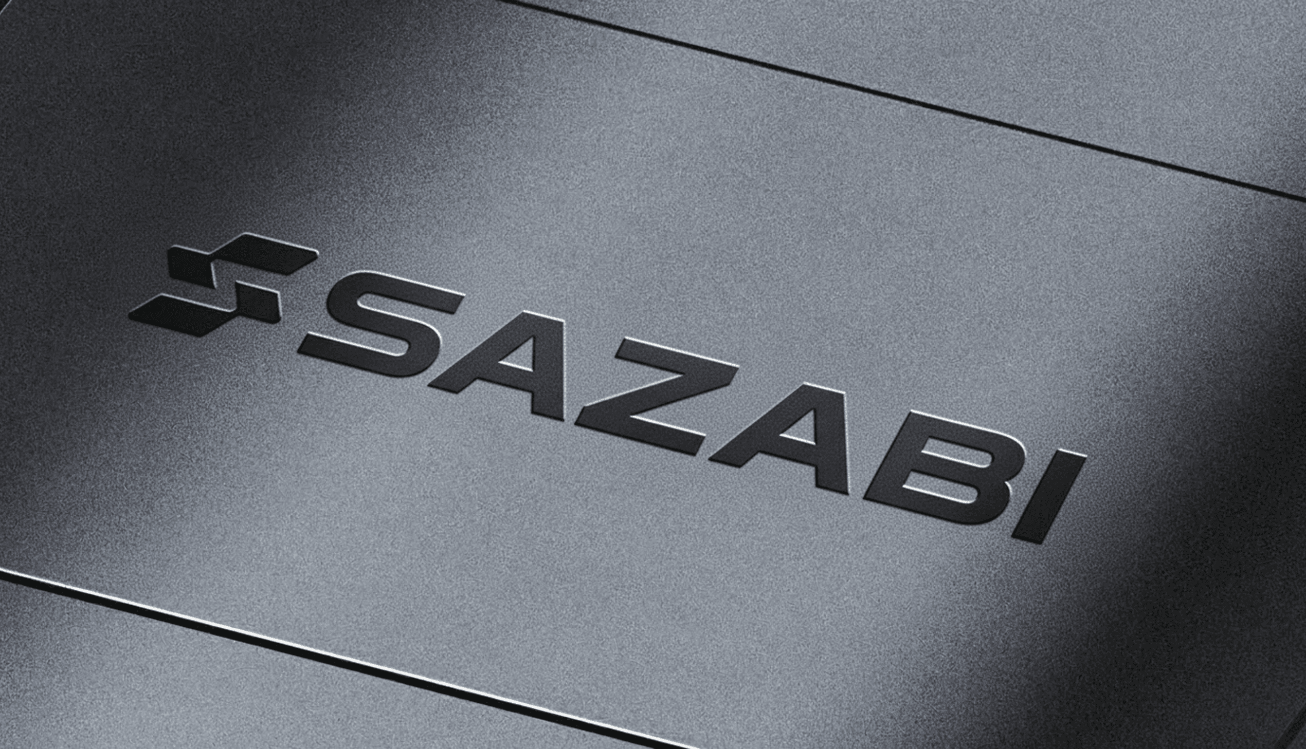 Sazabi wordmark embossed in brushed metal